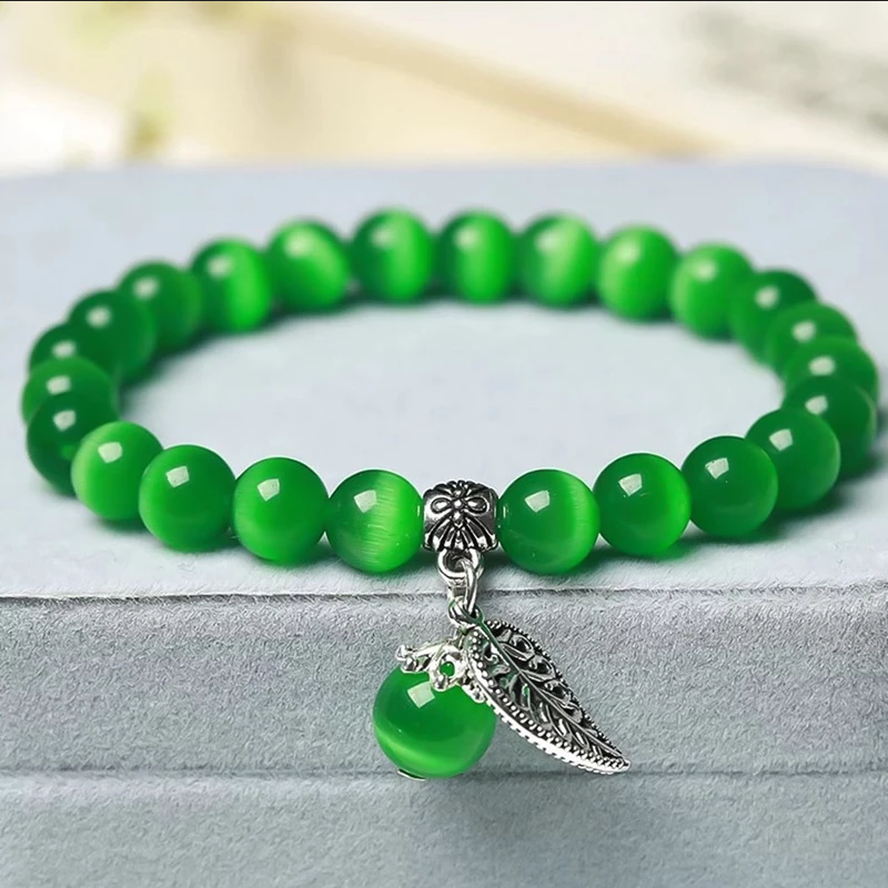 Armband kattenoog kralen groen met bedel blad