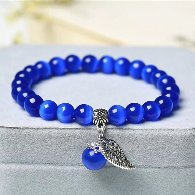 Armband kattenoog kralen blauw met bedel